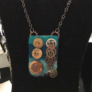 Hand felted rectangle with gear and button